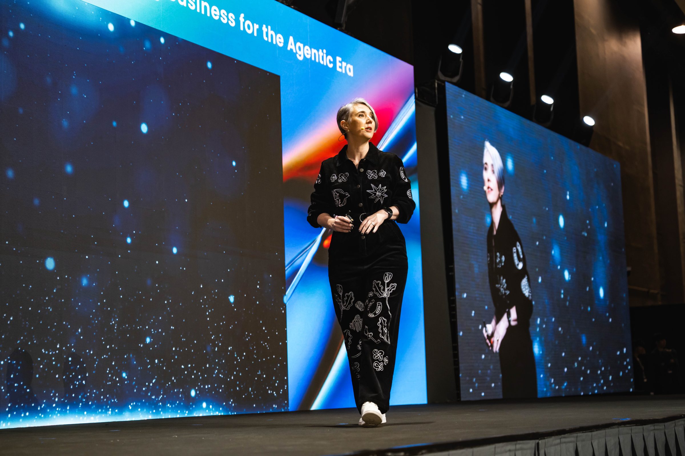 Katja Forbes speaking on stage about the agentic era